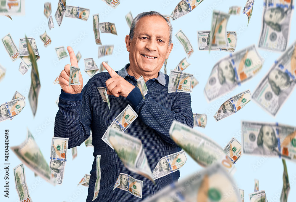 Senior handsome man wearing casual polo smiling and looking at the camera pointing with two hands and fingers to the side. Senior handsome man wearing casual polo smiling and looking at the camera pointing with two hands and fingers to the side.