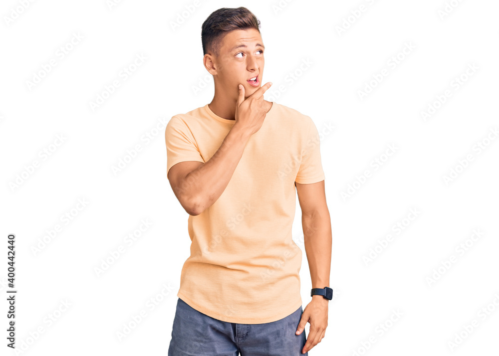 Fototapeta premium Young handsome man wearing casual clothes thinking worried about a question, concerned and nervous with hand on chin