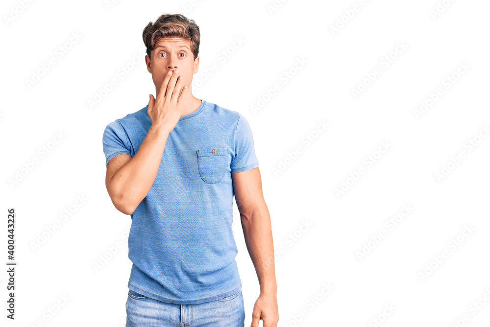 Young handsome man wearing casual clothes bored yawning tired covering mouth with hand. restless and sleepiness. Young handsome man wearing casual clothes bored yawning tired covering mouth with hand. restless and sleepiness.