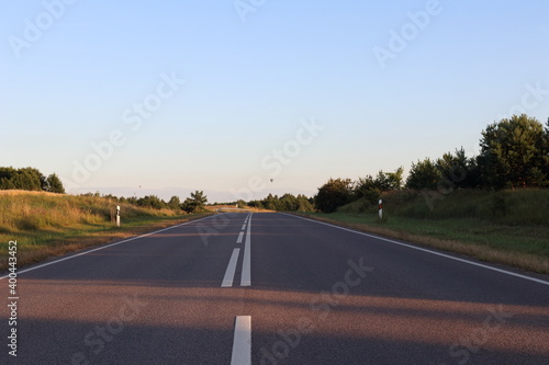 Summer road and hot air balloons