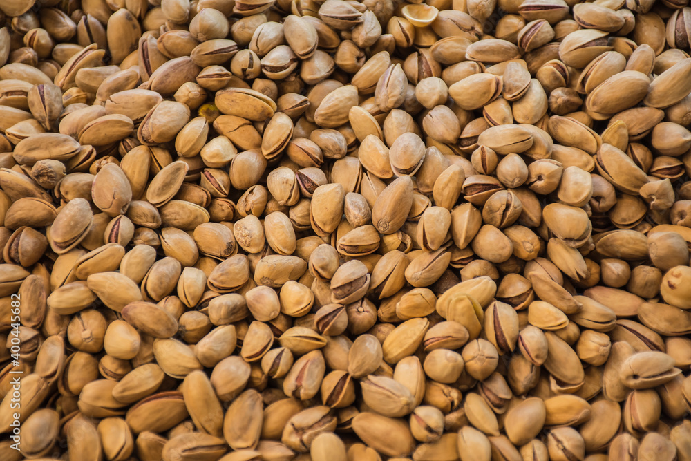 Pistachio texture. Nuts. Green fresh pistachios background. Top view. Roasted salted pistachio nuts healthy delicious food. Pistachio texture. Nuts. Green fresh pistachios background. Top view. Roasted salted pistachio nuts healthy delicious food.