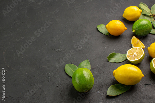 front view fresh lemons sour fruits on dark desk fruit lime tree citrus