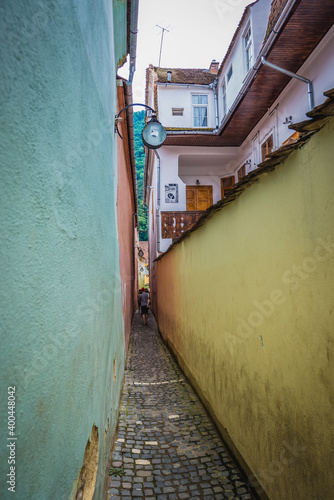 Famous narrow street Strada Sforii - english Rope or String Street in Brasov city, Romania photo