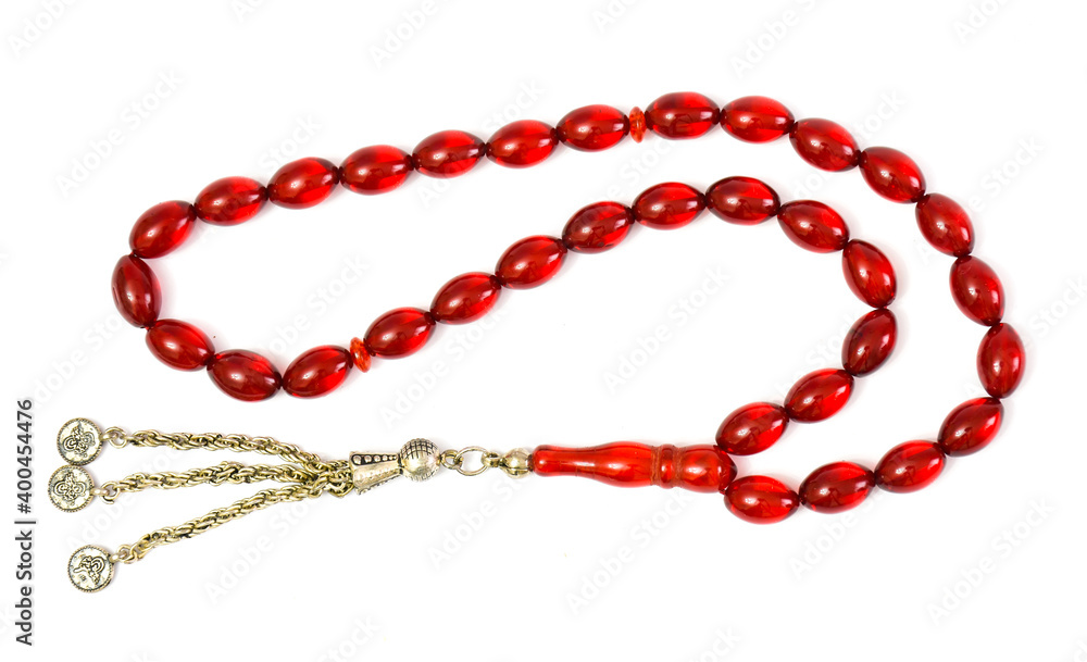 Red amber prayer beads (rosary) on white background. Red amber prayer beads (rosary) on white background.
