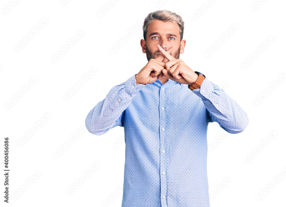 Young handsome blond man wearing elegant shirt rejection expression crossing fingers doing negative sign Young handsome blond man wearing elegant shirt rejection expression crossing fingers doing negative sign