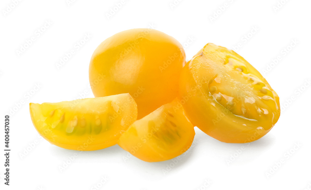 Cut ripe yellow tomatoes isolated on white