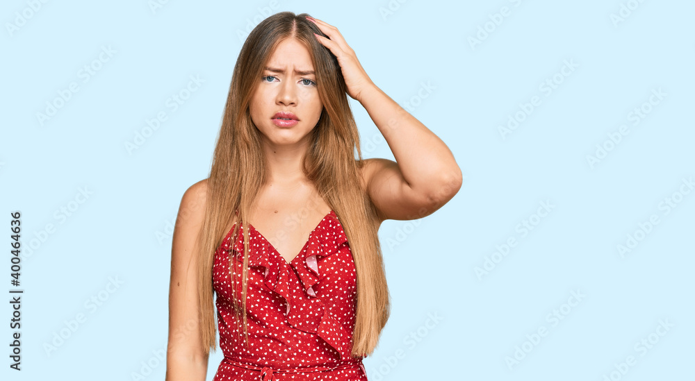 Beautiful blonde woman wearing summer dress confuse and wonder about question. uncertain with doubt, thinking with hand on head. pensive concept. Beautiful blonde woman wearing summer dress confuse and wonder about question. uncertain with doubt, thinking with hand on head. pensive concept.