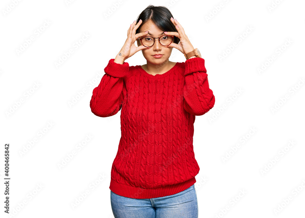 Young beautiful hispanic woman with short hair wearing casual sweater and glasses trying to open eyes with fingers, sleepy and tired for morning fatigue Young beautiful hispanic woman with short hair wearing casual sweater and glasses trying to open eyes with fingers, sleepy and tired for morning fatigue