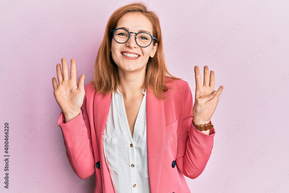 Young caucasian woman wearing business style and glasses showing and pointing up with fingers number nine while smiling confident and happy. Young caucasian woman wearing business style and glasses showing and pointing up with fingers number nine while smiling confident and happy.
