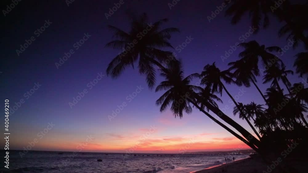 Sunset on the beach with tilted coconut tree beautiful golden sky Sunset on the beach with tilted coconut tree beautiful golden sky