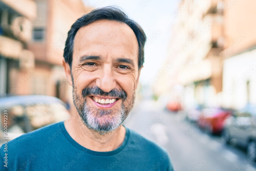 Middle age man with beard smiling happy outdoors Middle age man with beard smiling happy outdoors