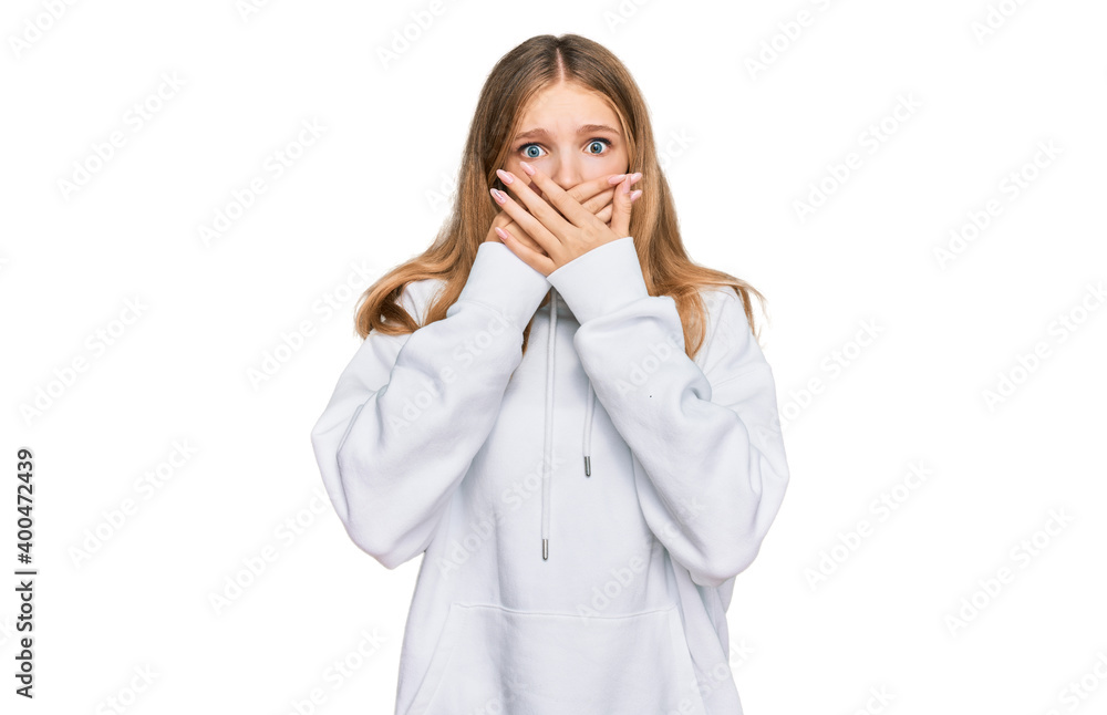 Beautiful young caucasian girl wearing casual sweatshirt shocked covering mouth with hands for mistake. secret concept. Beautiful young caucasian girl wearing casual sweatshirt shocked covering mouth with hands for mistake. secret concept.
