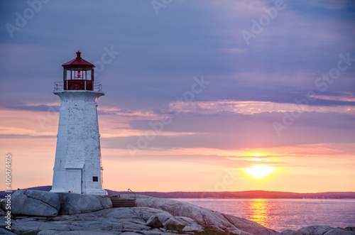 Peggy's Cove lighthouse at sunset photo