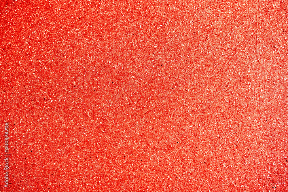 Fototapeta premium Abstract red background with glitter and bokeh closeup