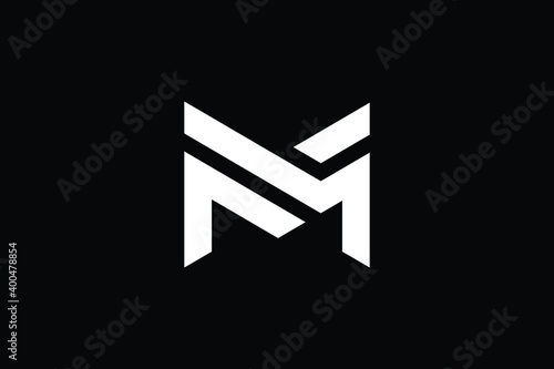 M logo letter design on luxury background. MM logo monogram initials letter concept. M icon logo design. MM elegant and Professional letter icon design on black background. M MM photo