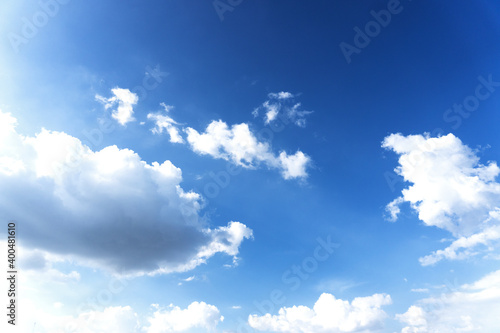 Landscape of the blue sky with clouds floating in the summer with natural sunlight over the creativity ideas on the abstract wide space background, refer to the hope and freedom of the future
