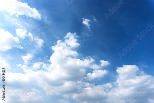 Landscape of the blue sky with clouds shape floating in the summer with natural sunlight over the creativity ideas on the abstract wide space background, refer to the hope and freedom of the future