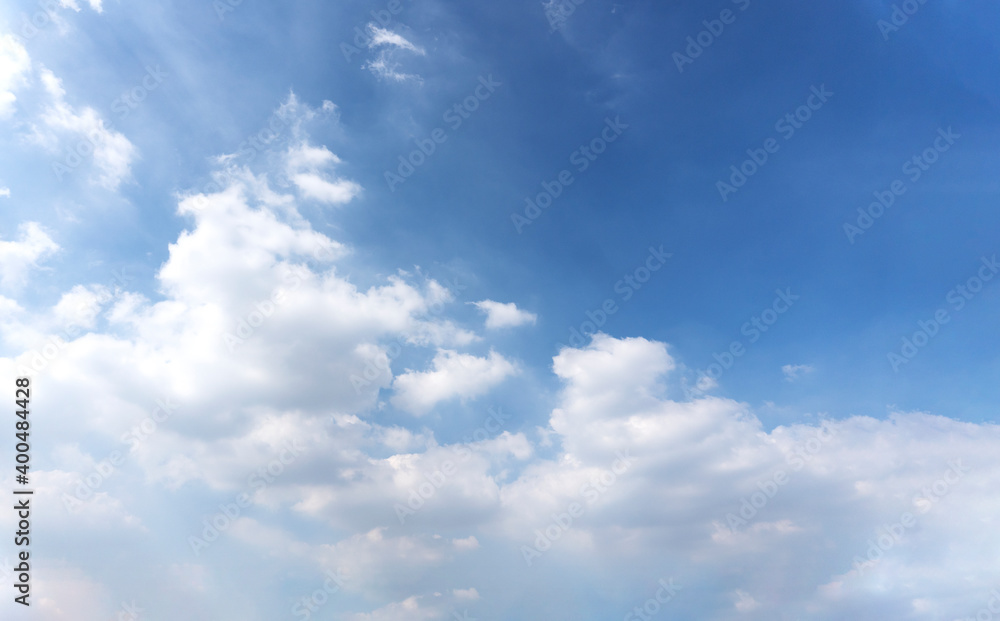 Landscape of the blue sky with clouds in the summer with natural sunlight over on the abstract wide space background, refer to the hope and freedom of the future