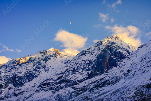 Serene Landscape of snow capped Pir Panjal mountains range during sunset twilight near Rohtang Pass enroute to Manali from Kaza town in Lahaul   Spiti district of Himachal Pradesh  India.