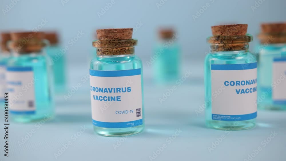 Flu measles coronavirus vaccine. Covid-19 coronavirus vaccine production line, cinematic close up of vaccination manufacturing. Vial. Biontech pfizer moderna novavax curevac astrazeneca vaccination. Flu measles coronavirus vaccine. Covid-19 coronavirus vaccine production line, cinematic close up of vaccination manufacturing. Vial. Biontech pfizer moderna novavax curevac astrazeneca vaccination.