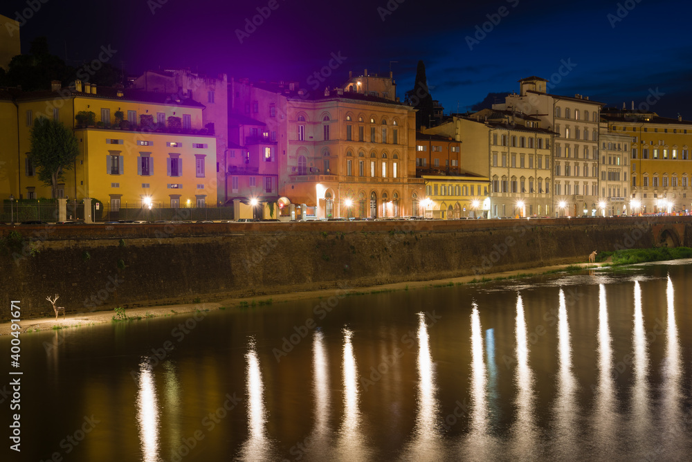 Old city embankment in the night illumination. Florence, Italy