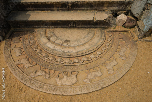 Ancient moonstone at the entrance to a Buddhist temple. Anuradhapura, Sri Lanka