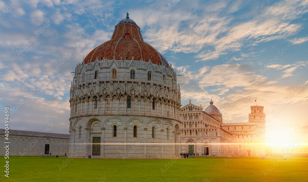 Cathedral (Duomo of Santa Maria Assunta) and The Baptistery of Pisa Leaning Tower at the Piazza dei Miracoli or the Square of Miracles - Pisa, Italy