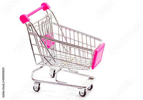 Metal shopping cart for purchases in a store on a white background.