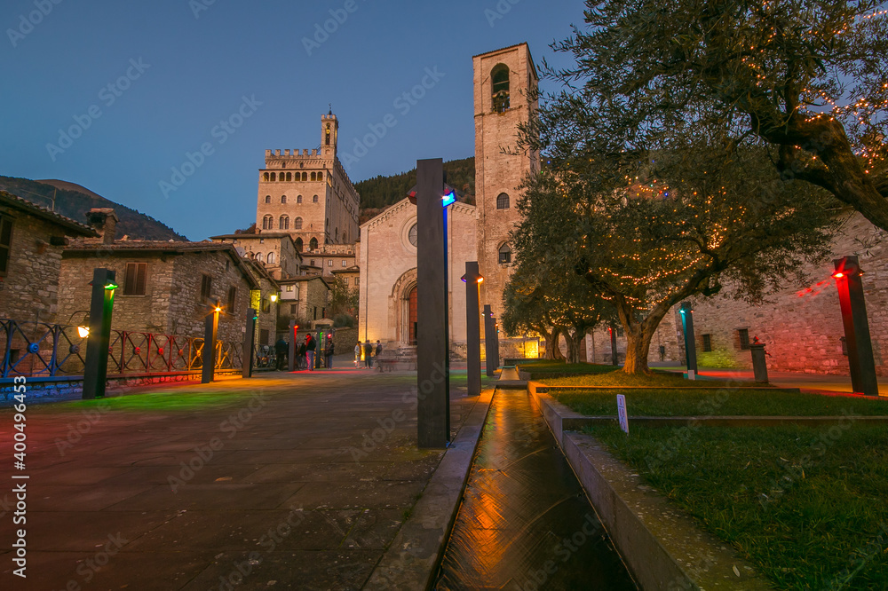 View of the piazza San Giovanni in the medieval center of Gubbio at christmas time illuminated with many colored lights