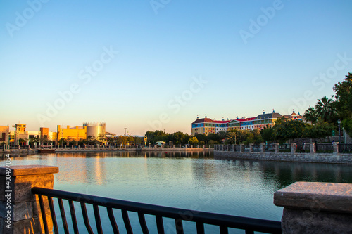 Colorful multi storey building on the lake at Dubai parks and resorts. UAE