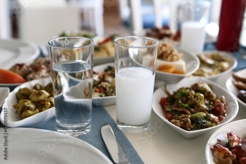 Turkish and Greek Traditional Dinning Table with Special Alcohol Drink Raki. Ouzo and Turkish Raki is a dry anise flavoured aperitif that is widely consumed in Turkey, Greece, Cyprus and Lebanon photo