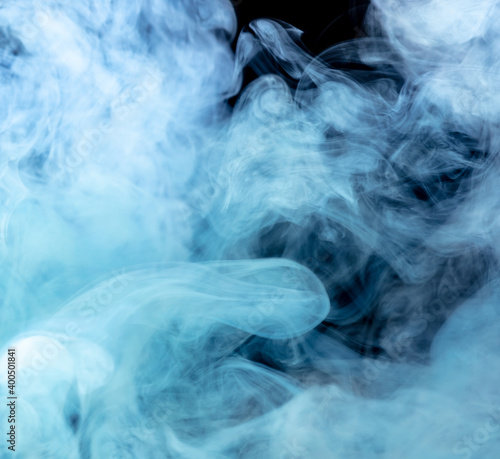 Blue smoke isolated on black background.