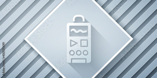 Paper cut Dictaphone icon isolated on grey background. Voice recorder. Paper art style. Vector.