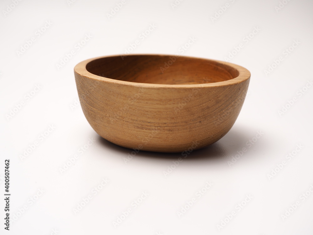 Closeup picture of wooden bowl, shoot on a white isolated background Closeup picture of wooden bowl, shoot on a white isolated background