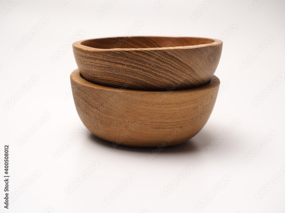 Closeup picture of wooden bowl, shoot on a white isolated background Closeup picture of wooden bowl, shoot on a white isolated background