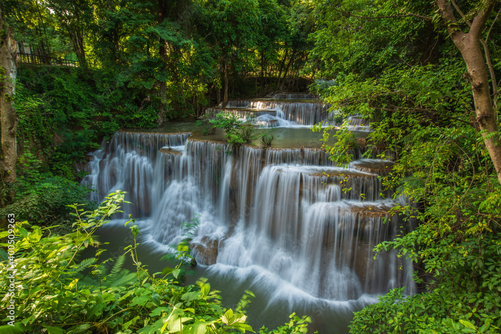 HUAY-MAE-KHA-MIN waterfall in the forest on the morning with sun rise HUAY-MAE-KHA-MIN waterfall in the forest on the morning with sun rise