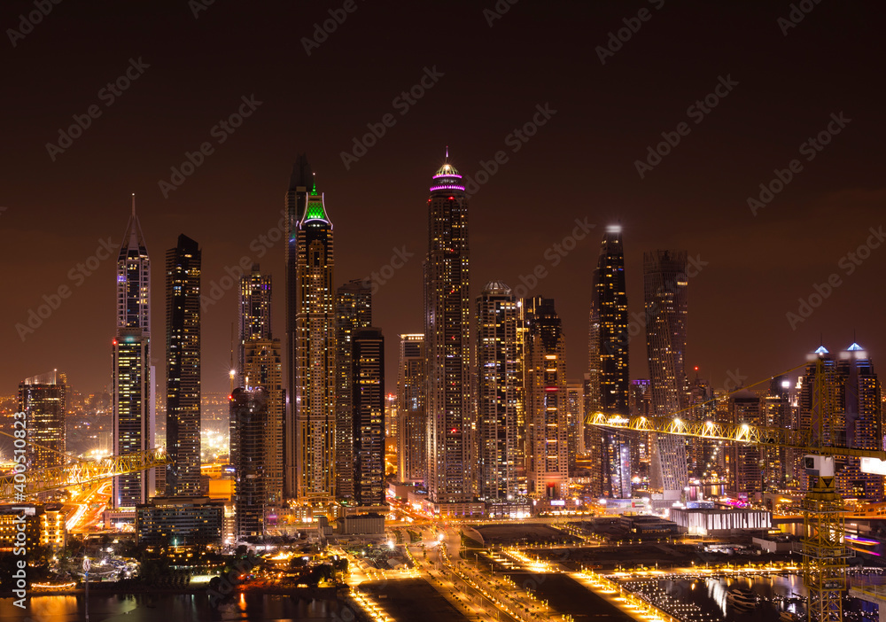 Dubai by night. The city and skyscrapers. The light in the night. The beauty of Dubai Marina just from the top.