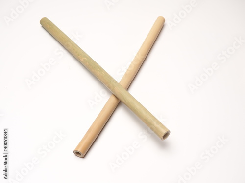 Close up shoot of a pair bamboo straw that more ecofriendly than plastic, shoot on a white isolated background