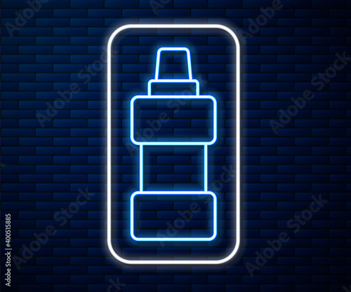 Glowing neon line Plastic bottle for laundry detergent, bleach, dishwashing liquid or another cleaning agent icon isolated on brick wall background.  Vector.