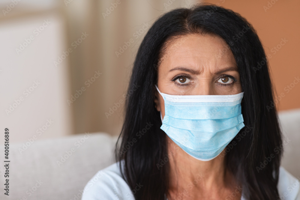 Portrait of serious woman wearing face mask to prevent infection Portrait of serious woman wearing face mask to prevent infection