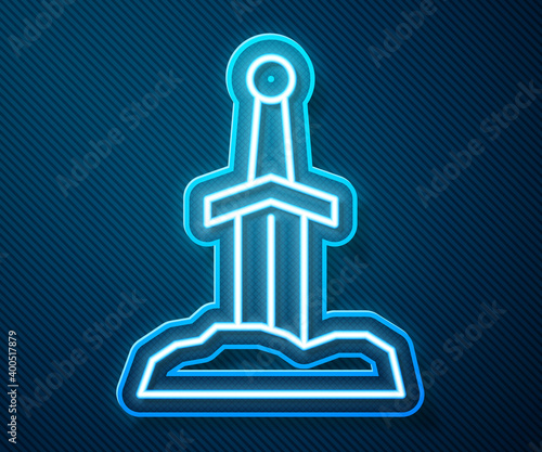 Glowing neon line Sword in the stone icon isolated on blue background. Excalibur the sword in the stone from the Arthurian legends.  Vector.