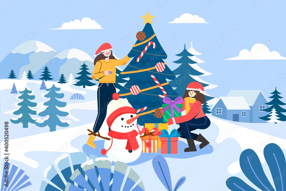 little sisters decorating the Christmas tree in the snow little sisters decorating the Christmas tree in the snow