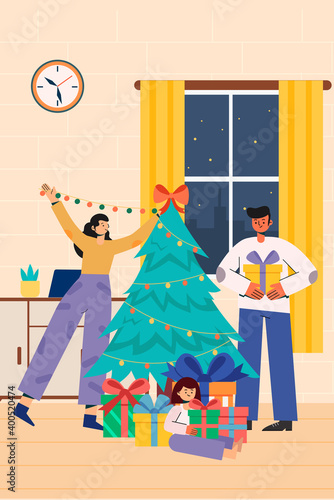 a family decorating Christmas Tree at home on Christmas Eve