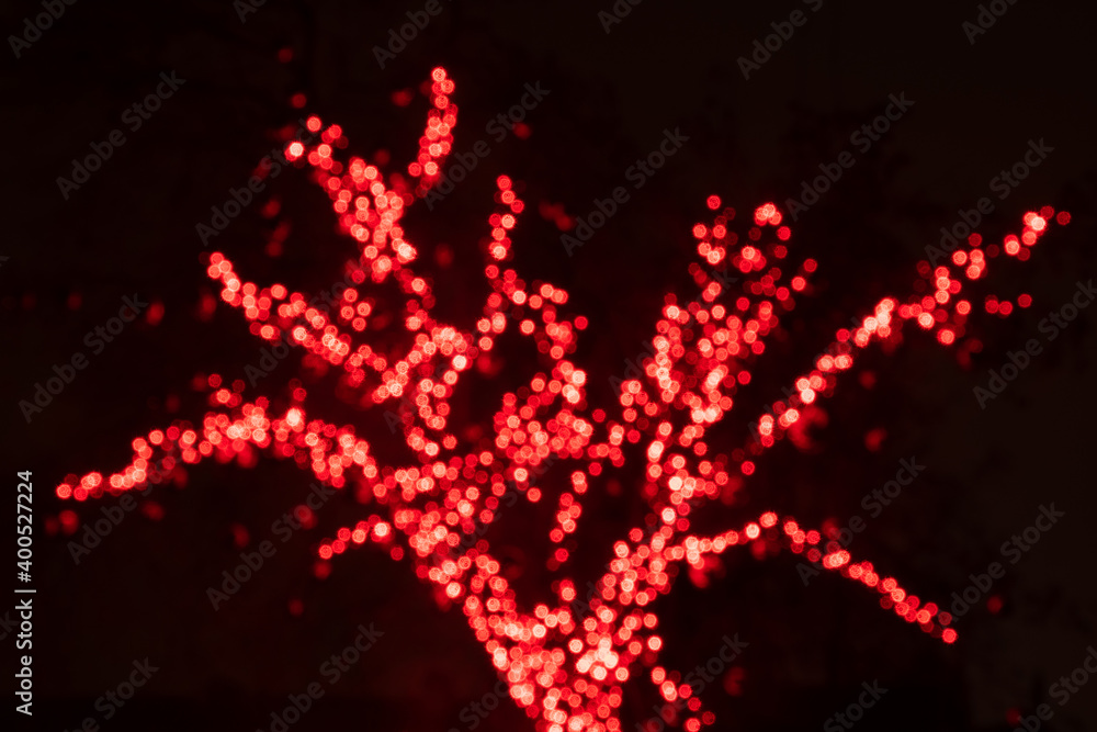 Abstract background redbokeh lights, branches of a tree in winter, warm feeling, warmth, celebration, magic dream, happy Christmas and new year Abstract background redbokeh lights, branches of a tree in winter, warm feeling, warmth, celebration, magic dream, happy Christmas and new year