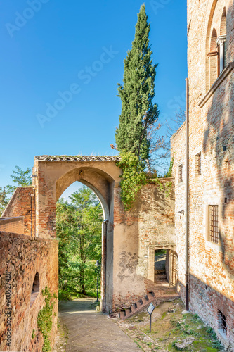 The ancient Porta Alberti with gothic arch at the entrance to the historic center of Certaldo Alto, Italy