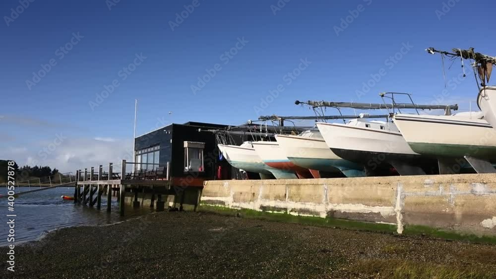 Yachts at Dell Quay and a view of the estuary at low tide at this popular boating destination. Yachts at Dell Quay and a view of the estuary at low tide at this popular boating destination.
