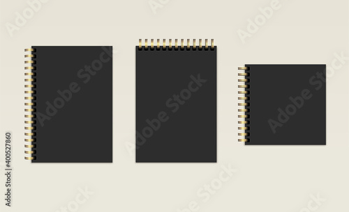 Vector realistic black notebooks. Mockup set. Different shapes. Closed notepad, organizer, diary on a beige background. Blank template for branding, corporate style, and design. EPS10.