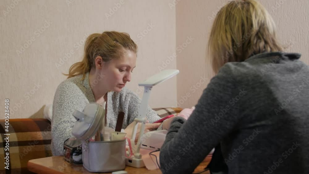 Manicure woman with phone beauty care Manicure woman with phone beauty care