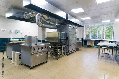 Fototapeta Naklejka Na Ścianę i Meble -  Restaurant kitchen equipment for preparing food, meal, plates, detail.