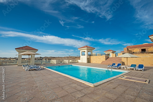 Rooftop swimming pool in a luxury tropical hotel resort © Paul Vinten